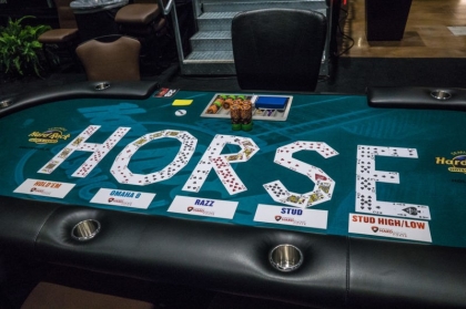 cards on a poker table which spell horse